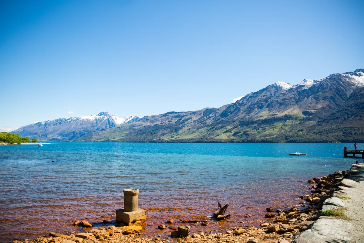 Lake Wakatipu's blue water and snow-capped mountains near Queenstown